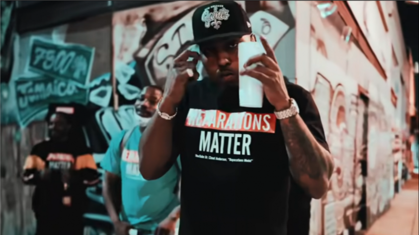 Clyde Carson holding up a cup